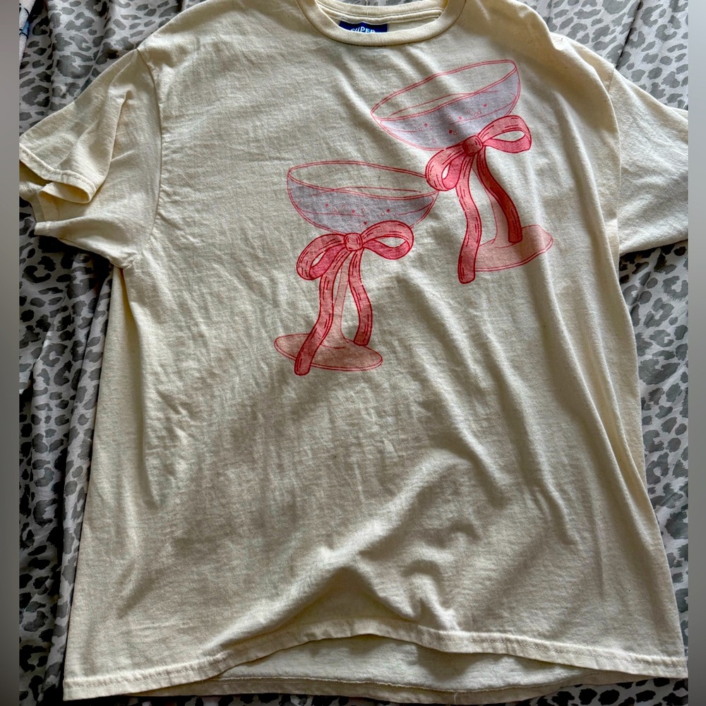 Cream T-Shirt with Pink Bow Design. Size M/L
